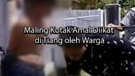 colchicinen Maling Kotak Amal Diikat di Tiang oleh Warga